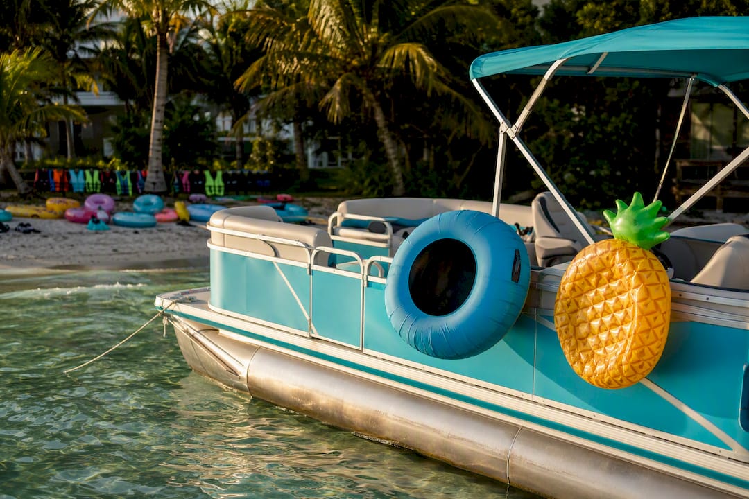 Pontoon boat deck with floats and captain's wheel