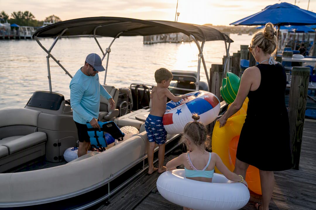 Preparing pontoon boat for Destin tour bright day