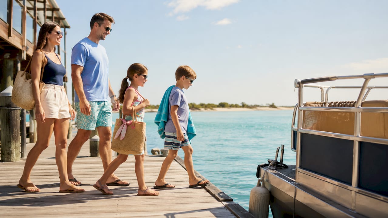 Family boarding a guided Crab Island tour