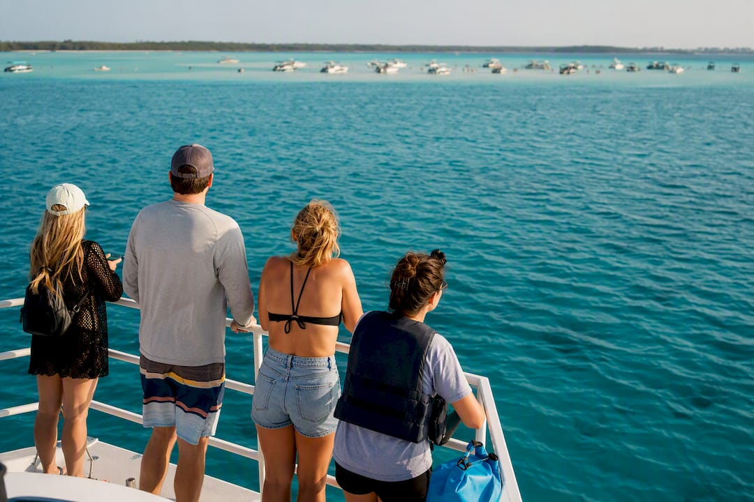 Visitors boarding a Crab Island tour