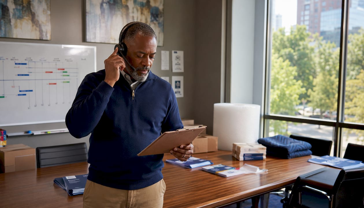 Moving coordinator managing vendors on headset