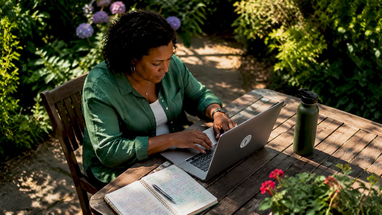 Woman troubleshooting IT issues at home office desk