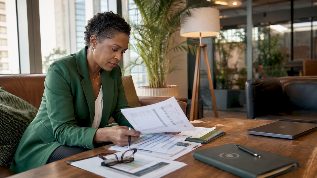 Compliance officer reviewing cybersecurity documents