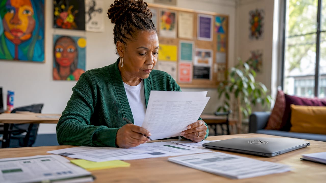 Nonprofit staff reviewing IT budget documents