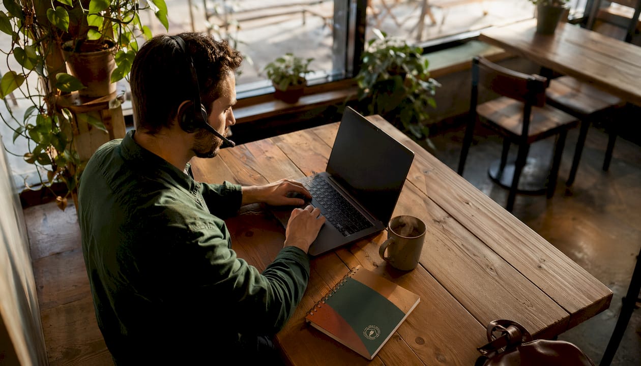 IT technician at help desk workspace typing