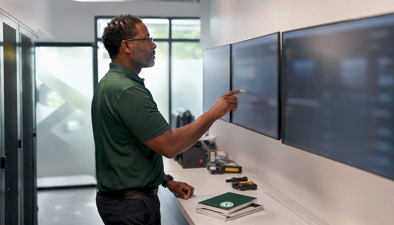 Technician monitoring factory network bandwidth