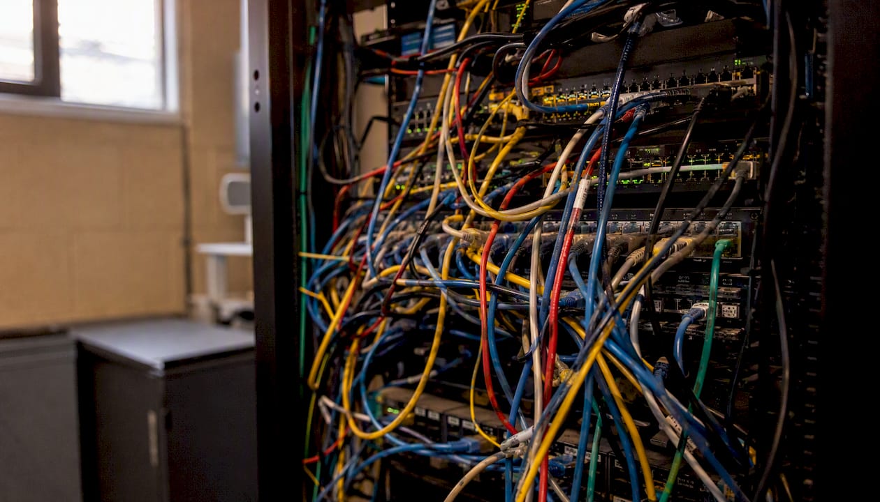 Tangled network cables in server rack