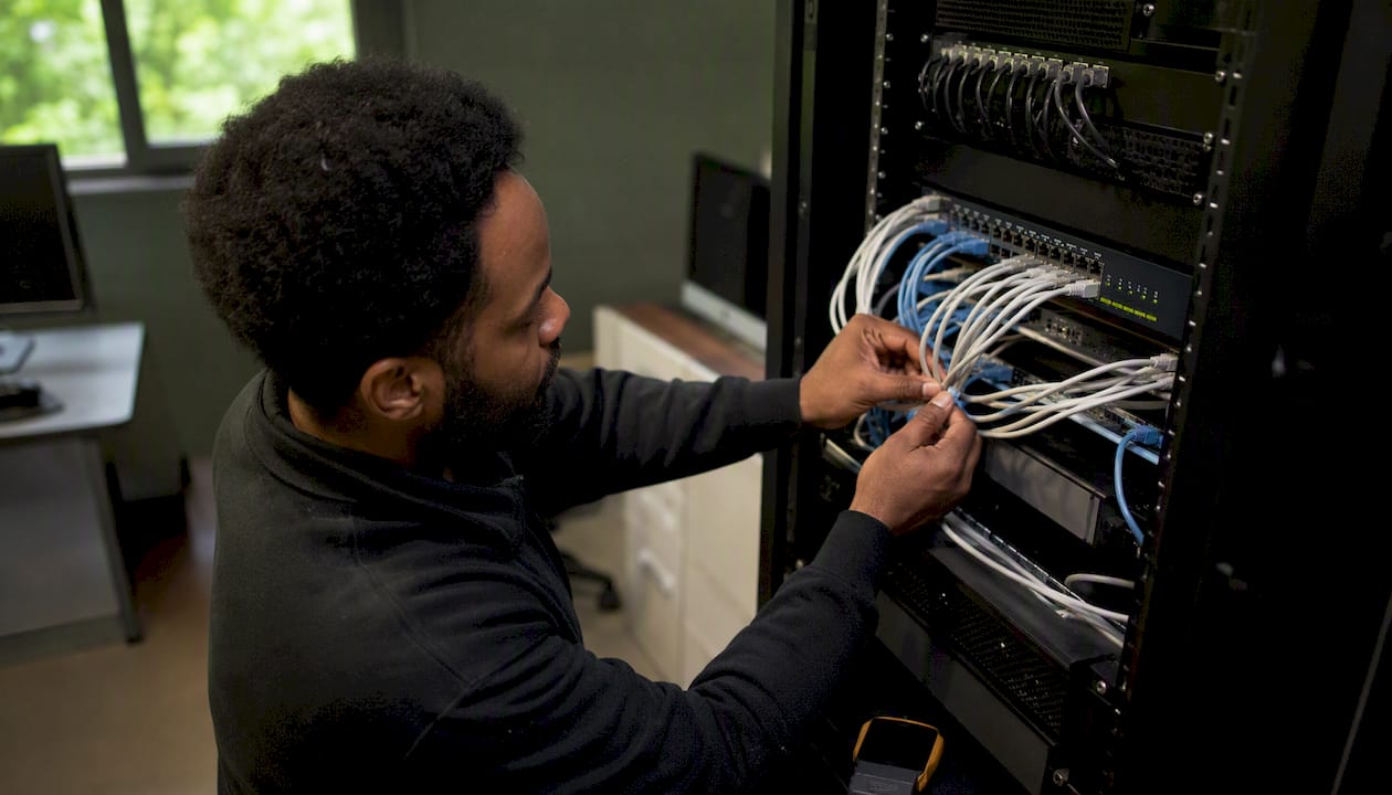 Hands bundling and labeling network cables