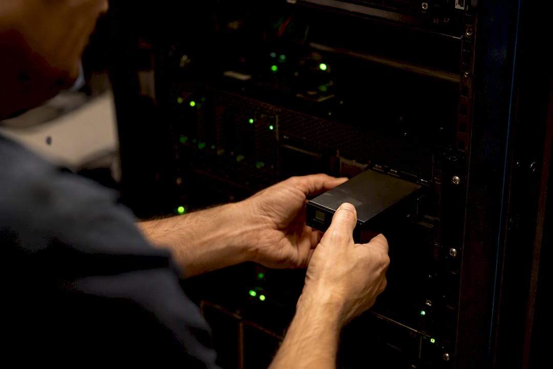 Technician inserting air-gapped backup drive