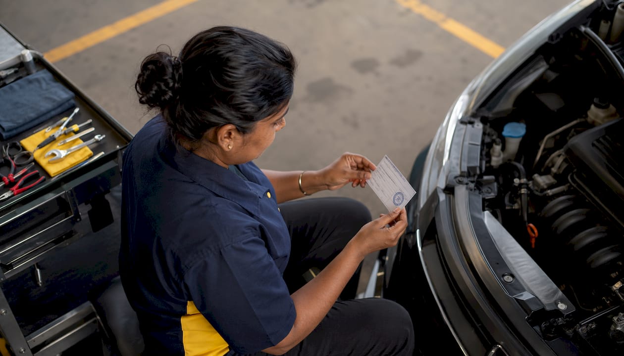 Technician showing certification and tablet