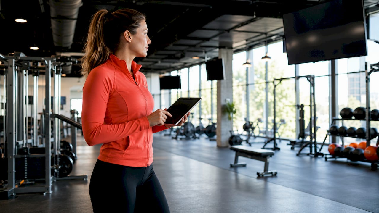 Manager controlling multi-zone screens in fitness studio