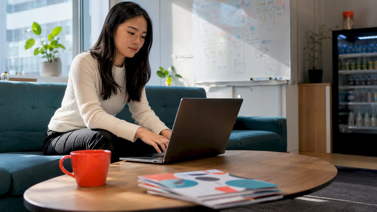 Woman managing network hardware in server room