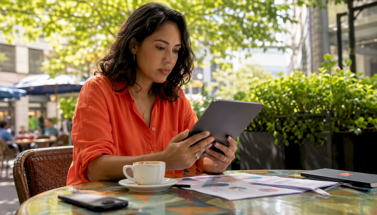 Woman analyzing member engagement data on tablet