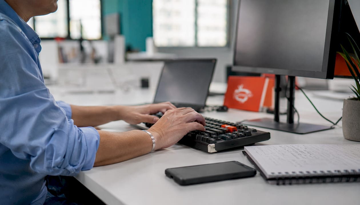 IT specialist’s hands managing digital signage devices