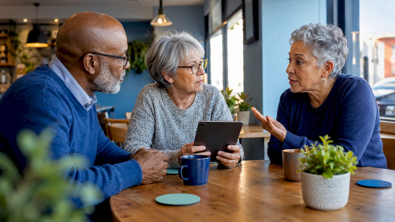 Seniors discussing scam prevention tips