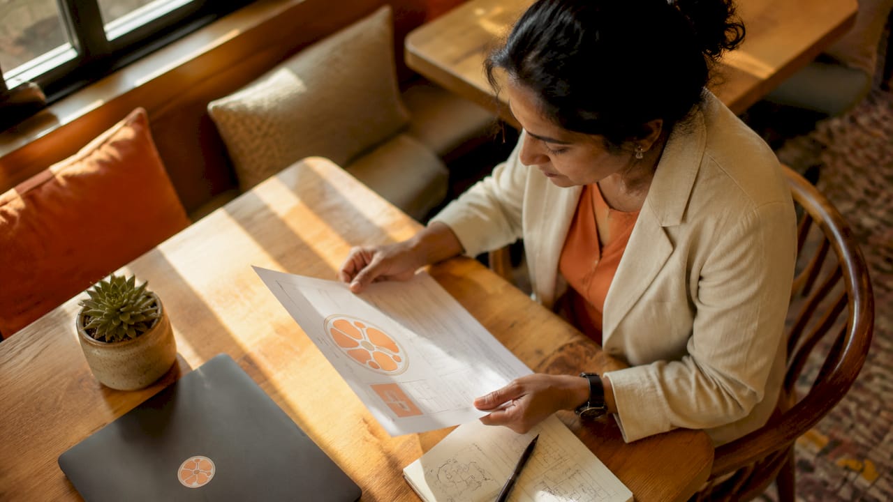 Woman reviewing AI setup instructions at desk