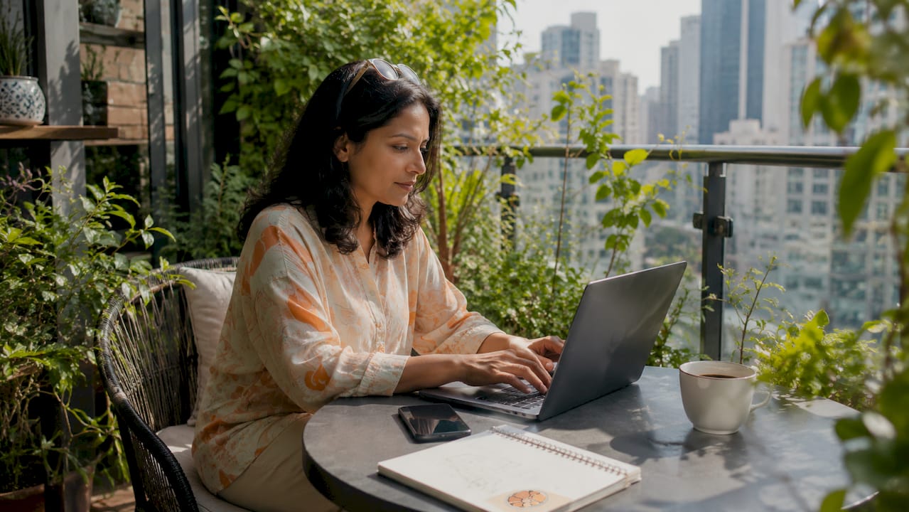 Woman typing at laptop in office