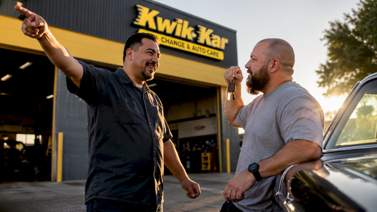 Two men discussing auto repair shop referral outside