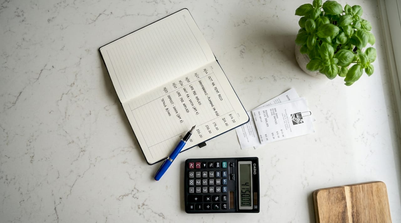 Financial records and calculator on desk