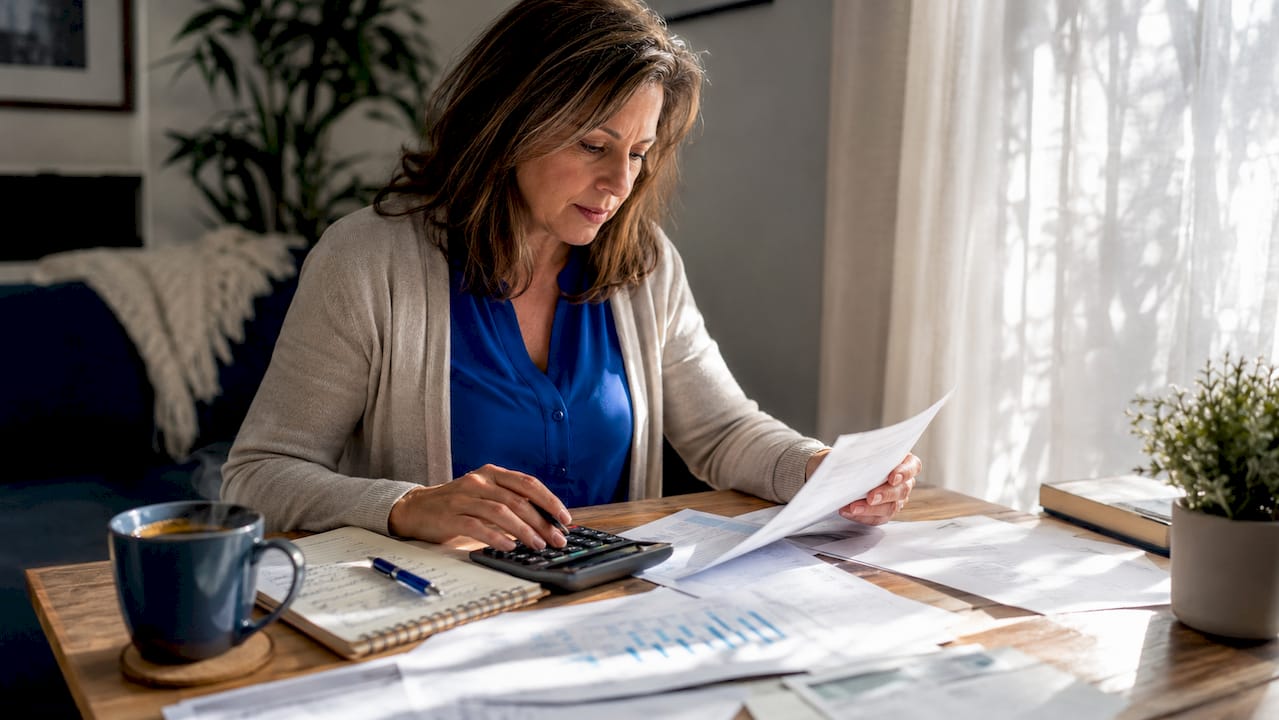 Investor analyzing rental property finances at home
