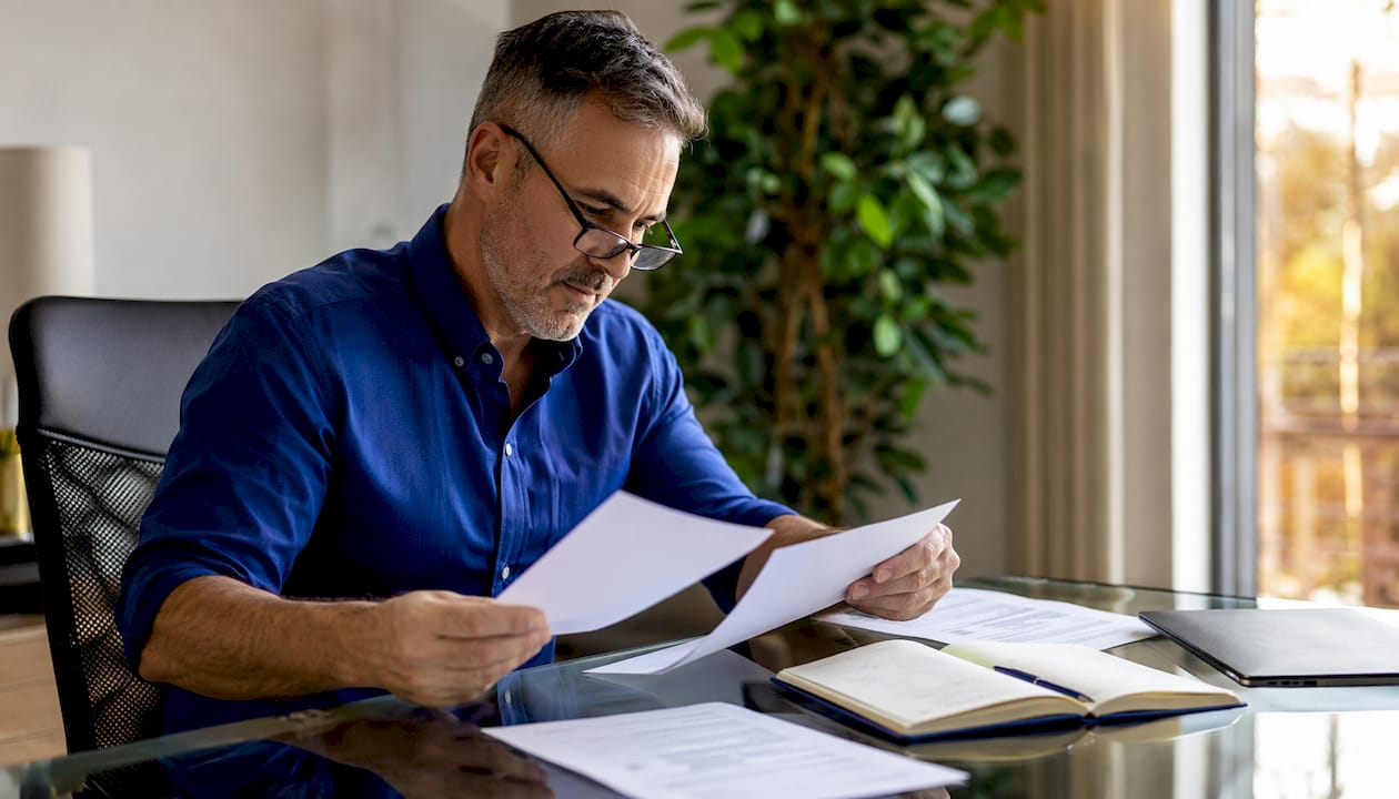 Investor reviewing single family rental lease documents