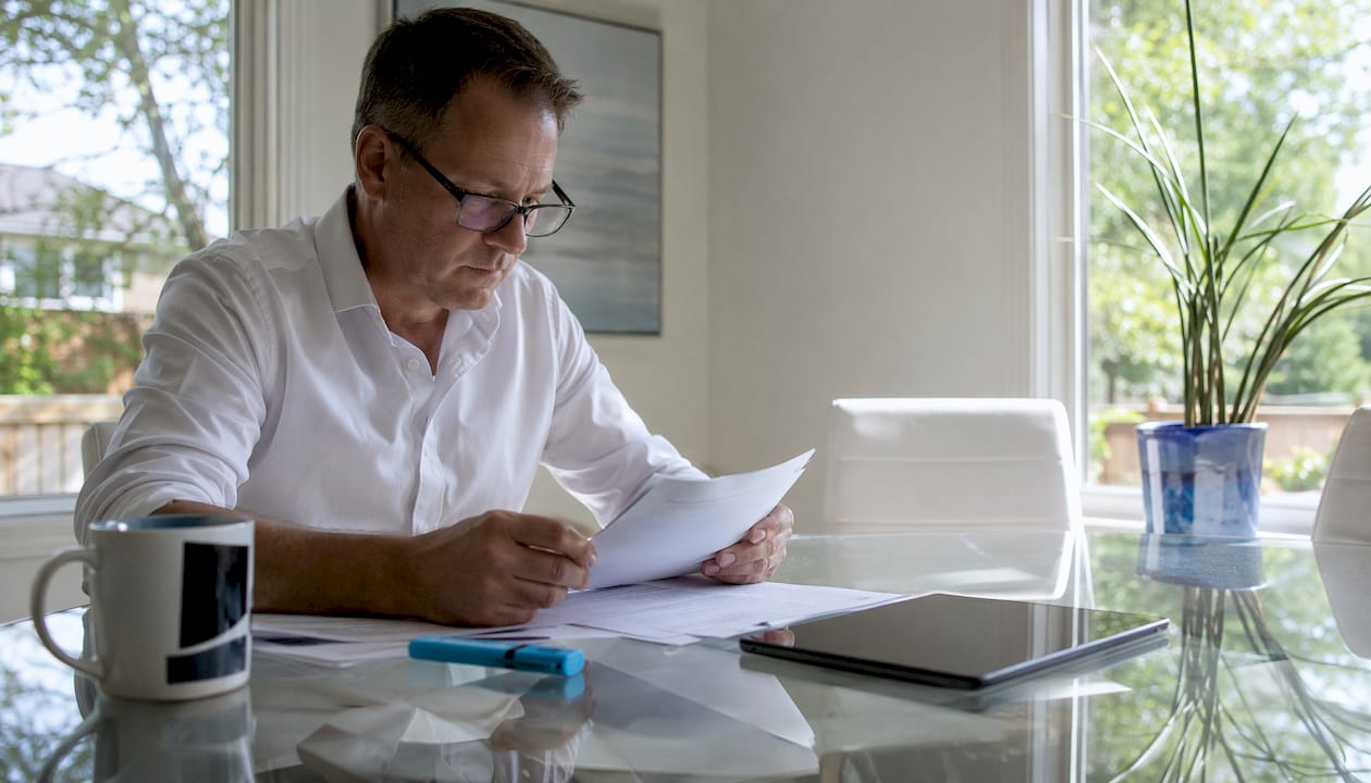 Landlord reviewing flood insurance documents