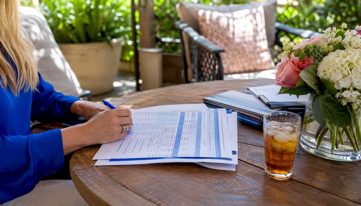 Close-up of hands analyzing DSCR loan documents