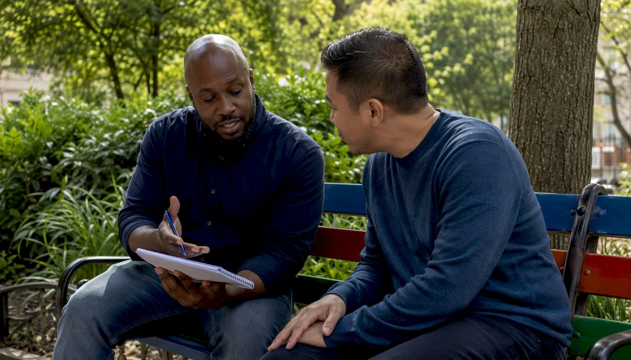 Two landlords discussing property management