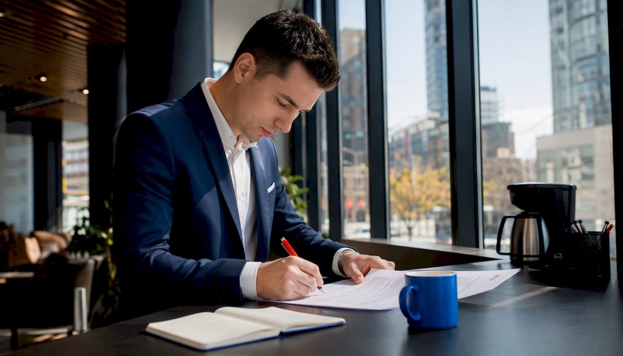 Leasing agent working on software to manage vacancies