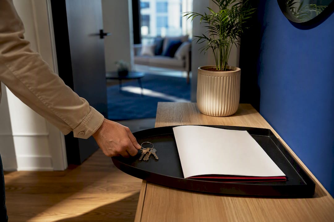 Renter placing keys beside lease agreement
