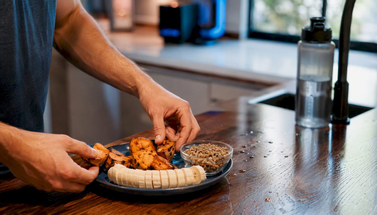 Athlete preparing carb-rich meal before exercise