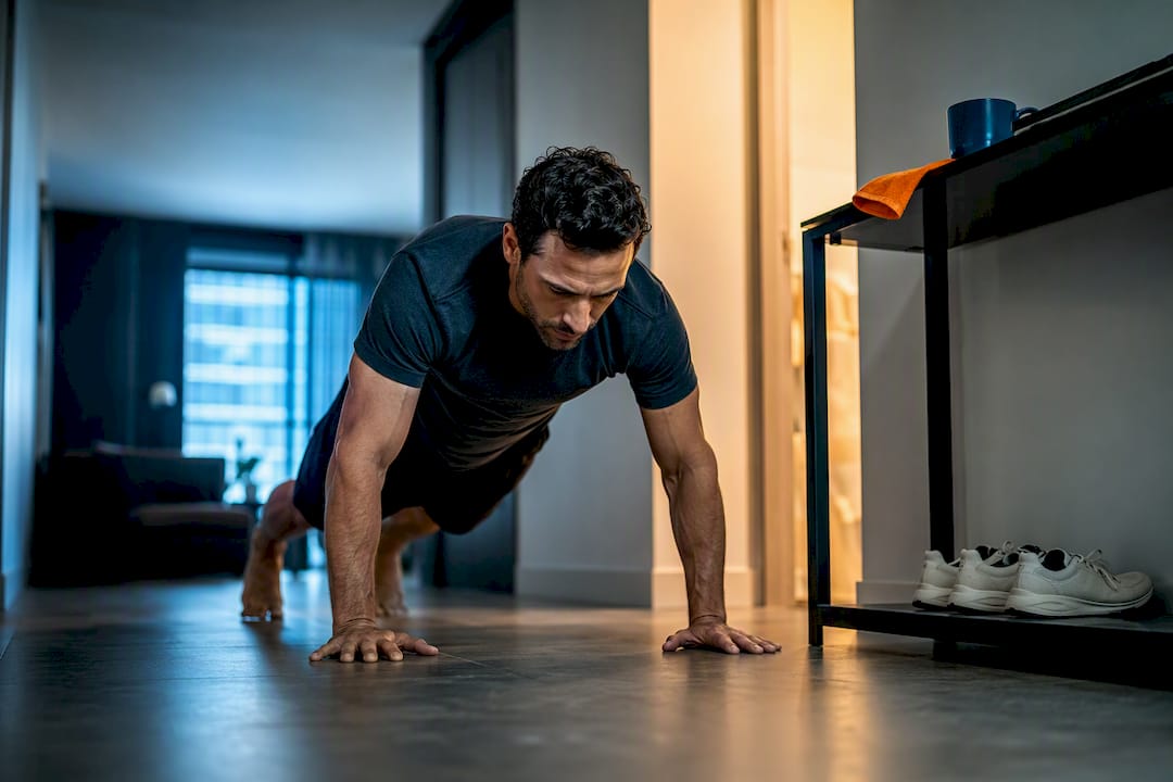 Professional doing pushups after morning coffee