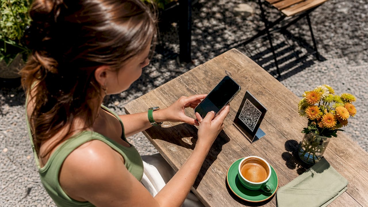 Customer scanning QR code to tip digitally