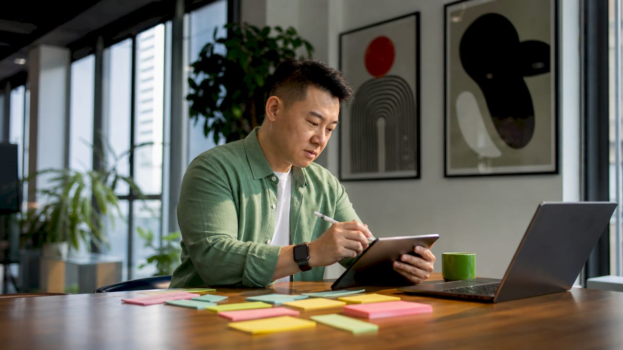 Engineer working on payment network code at desk
