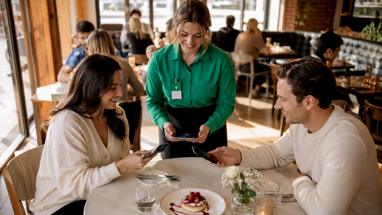Restaurant server receiving digital tip via NFC badge