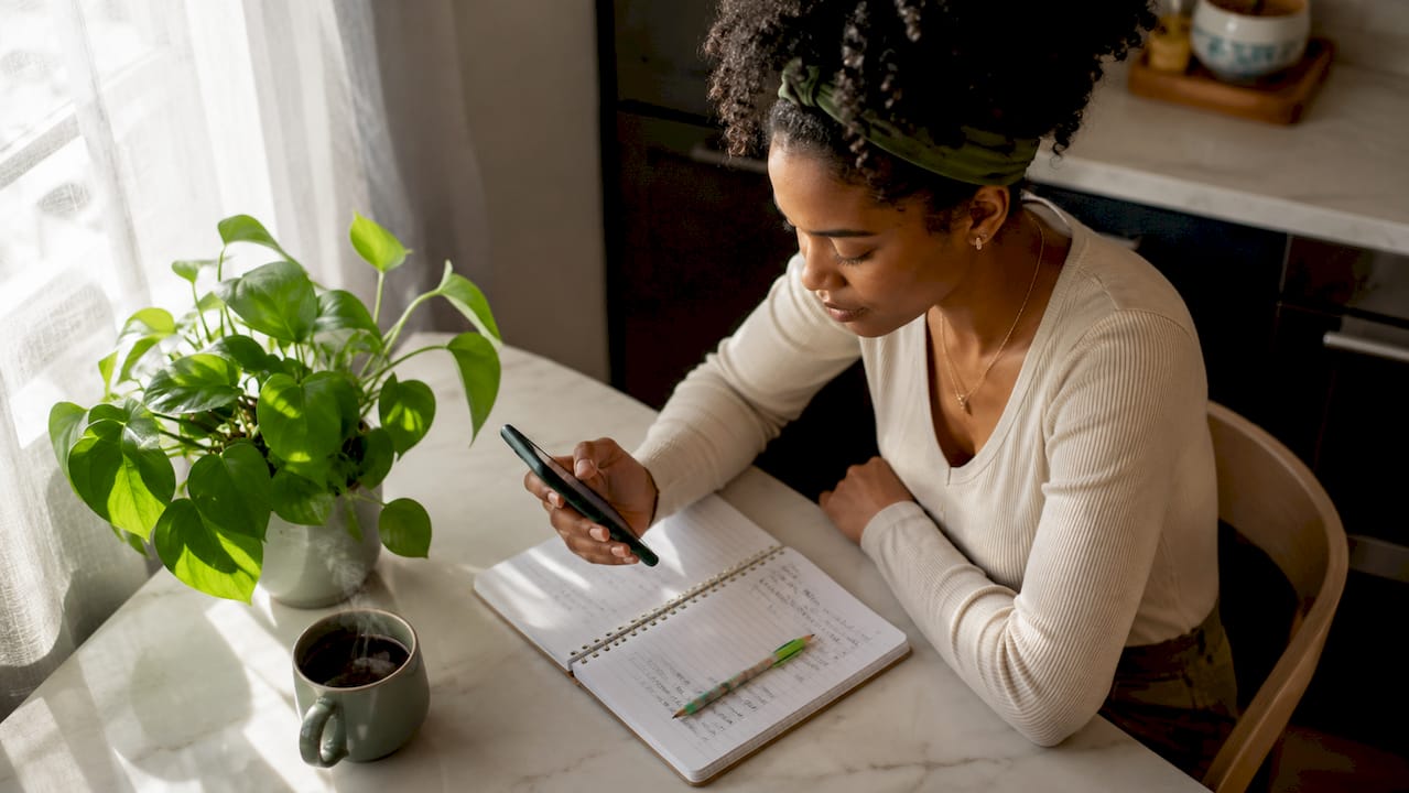 Woman reviewing customer tips on smartphone