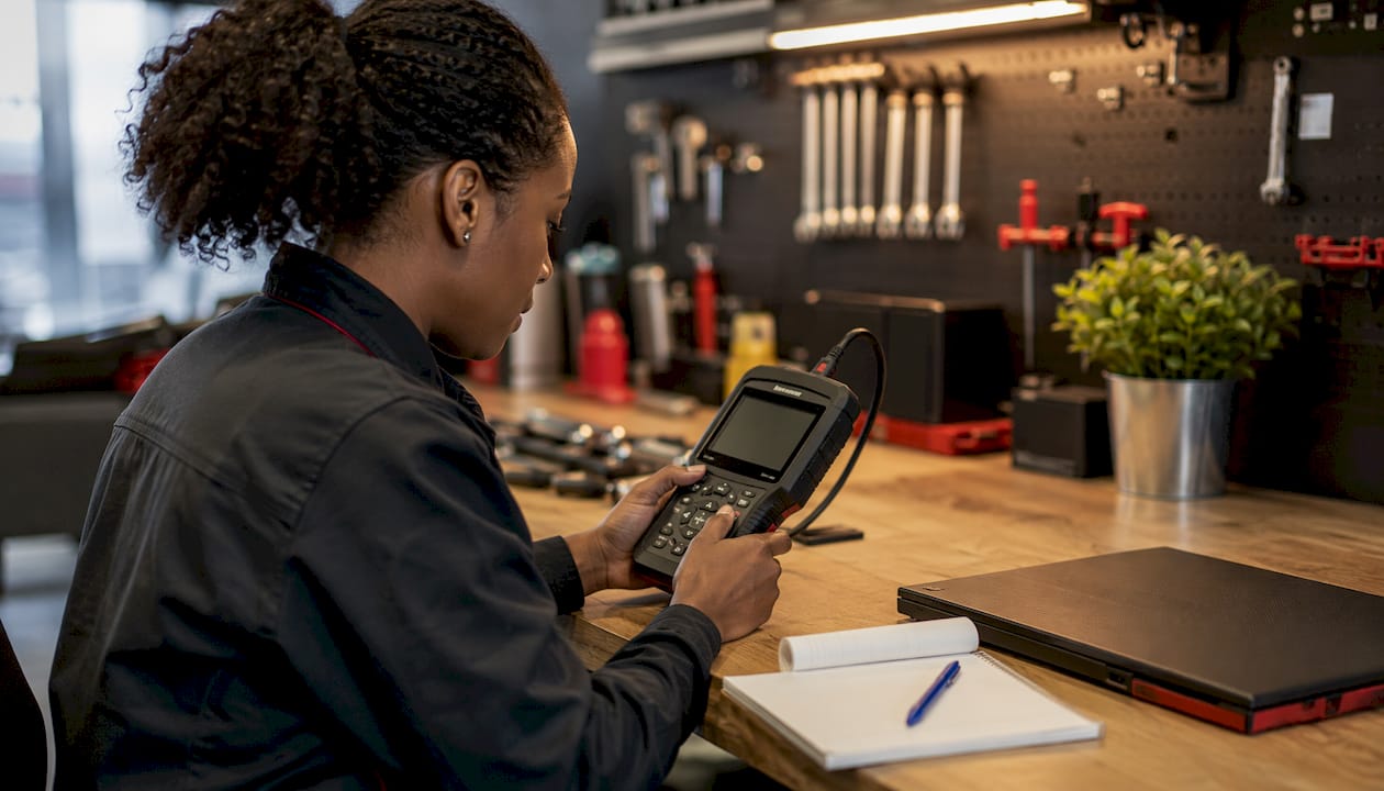 Technician using scan tool hands close-up