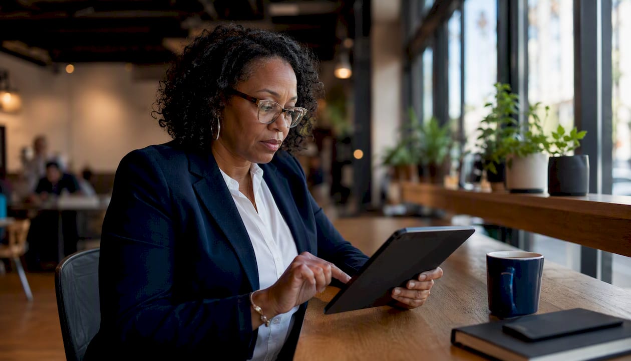 Investor working at home office multitasking on screens