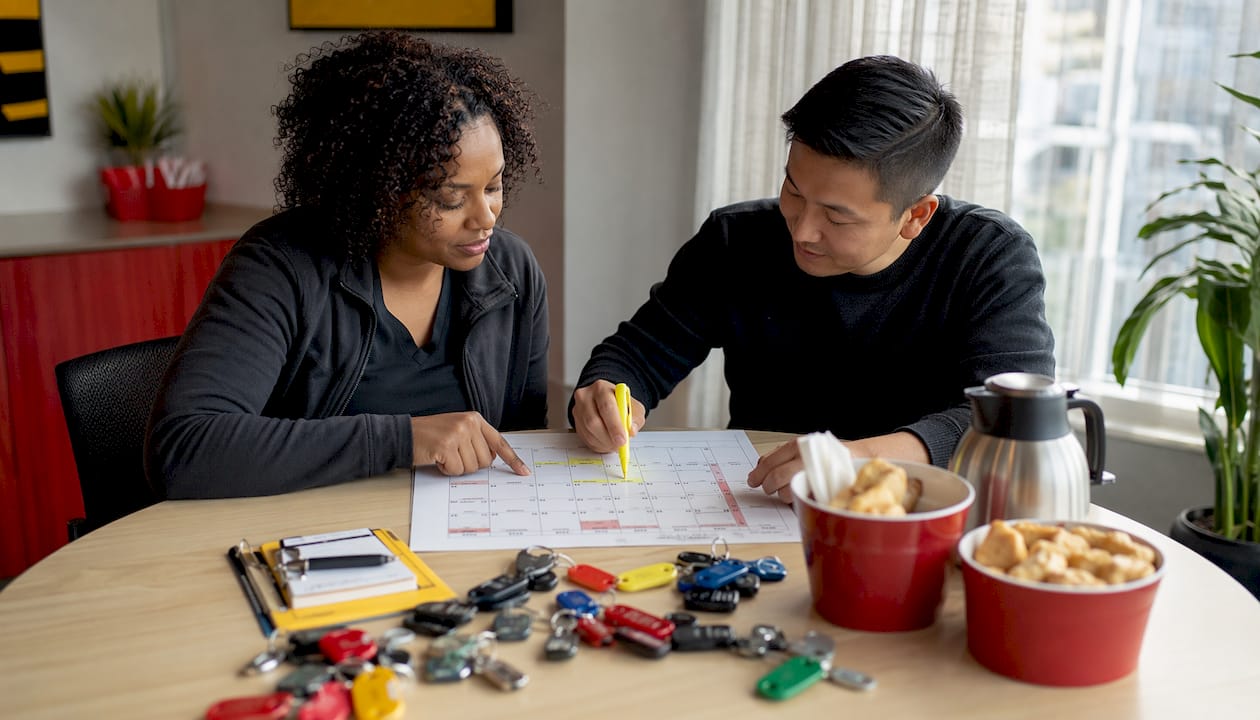 Fleet managers reviewing maintenance schedule