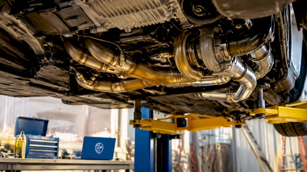 Exhaust Upgrade Remap: What It Is And Why It Matters Turbocharged Engine With Upgraded Exhaust System Close-Up