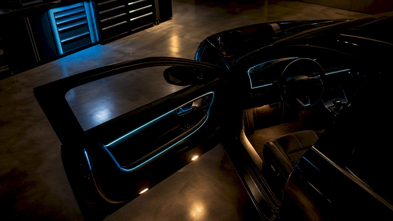 Close-up of vehicle door with ambient and accent lighting