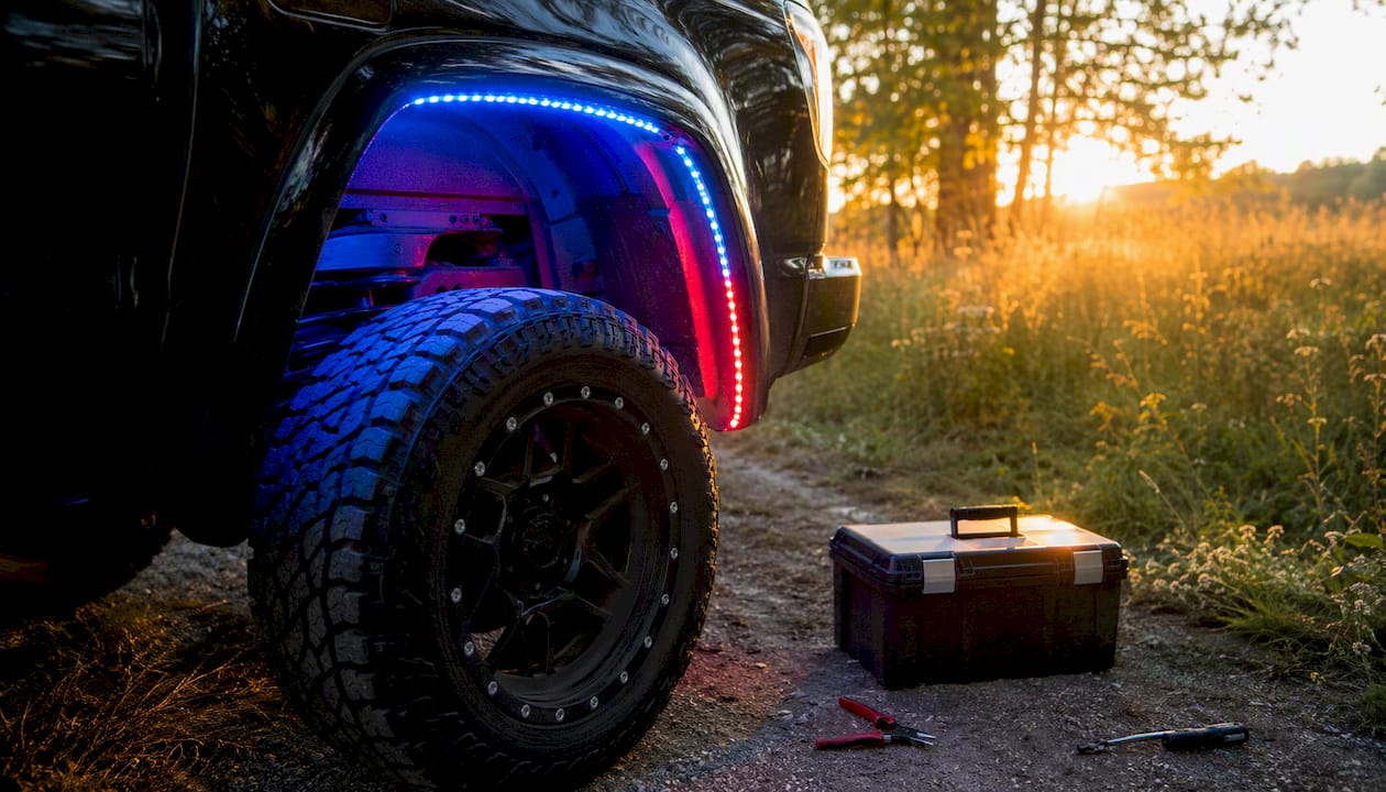 Close-up of RGB LED lighting on truck wheel well
