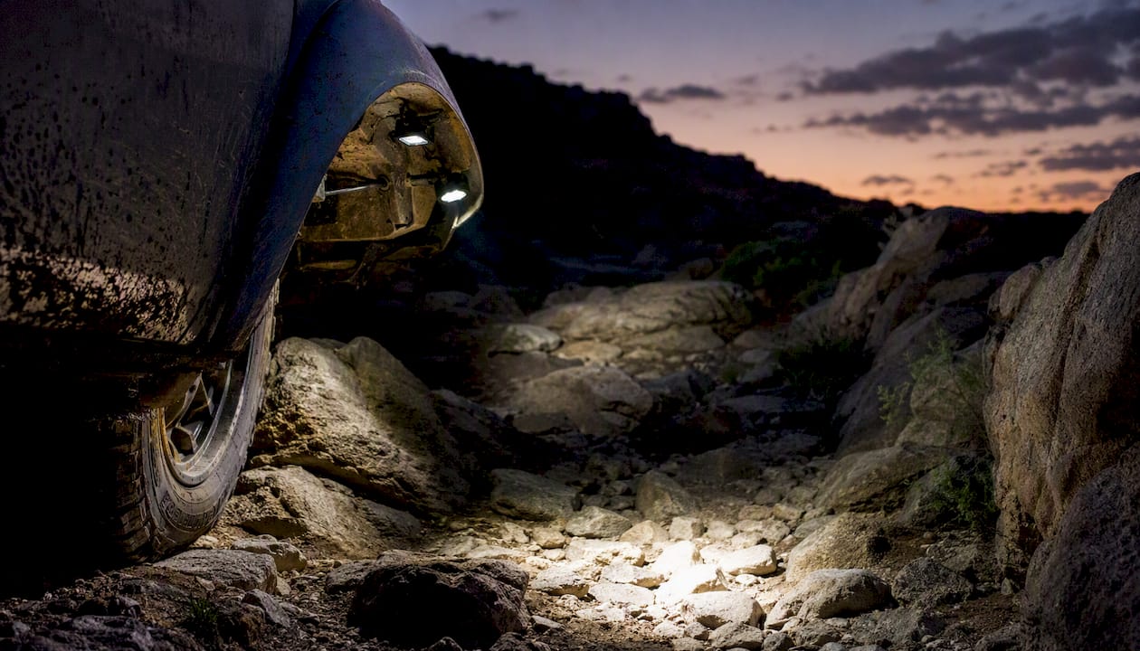 Rock lights on off-road truck illuminating trail