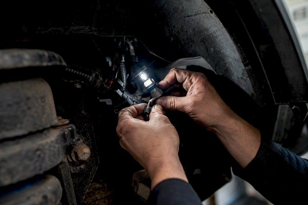 Hands installing CANbus-compatible LED light