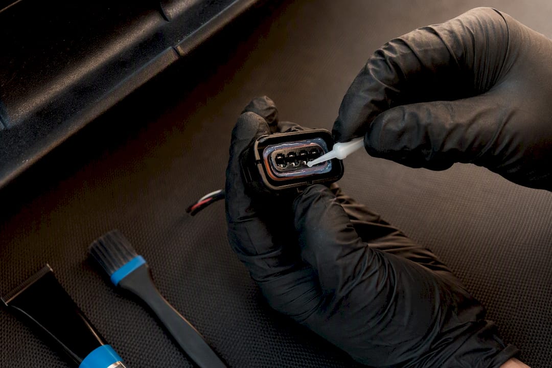Technician inspecting sealed lighting connector