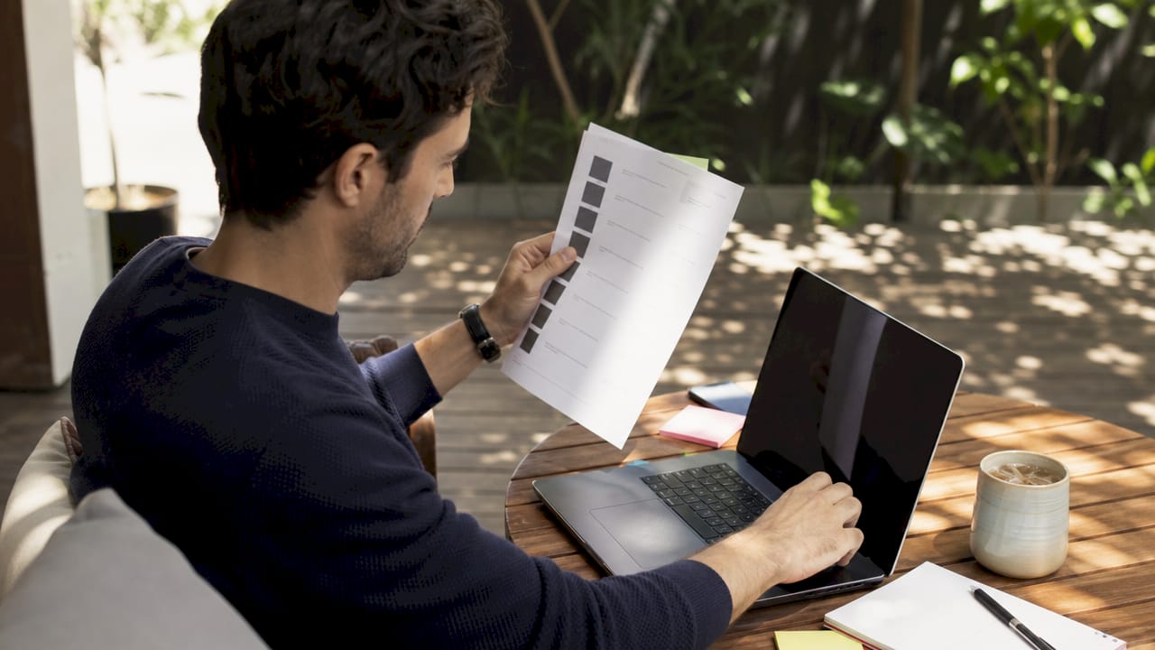 Close-up of hands reviewing customer segments list