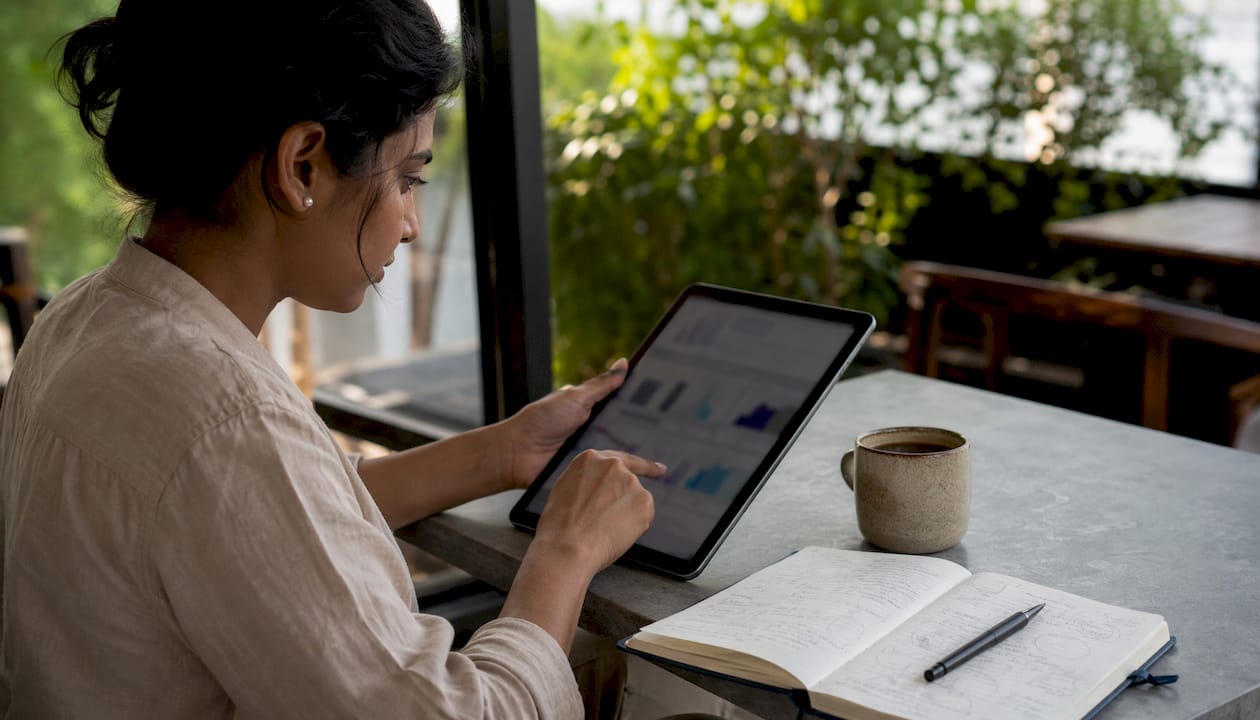Woman reviewing Klaviyo A/B test examples on tablet