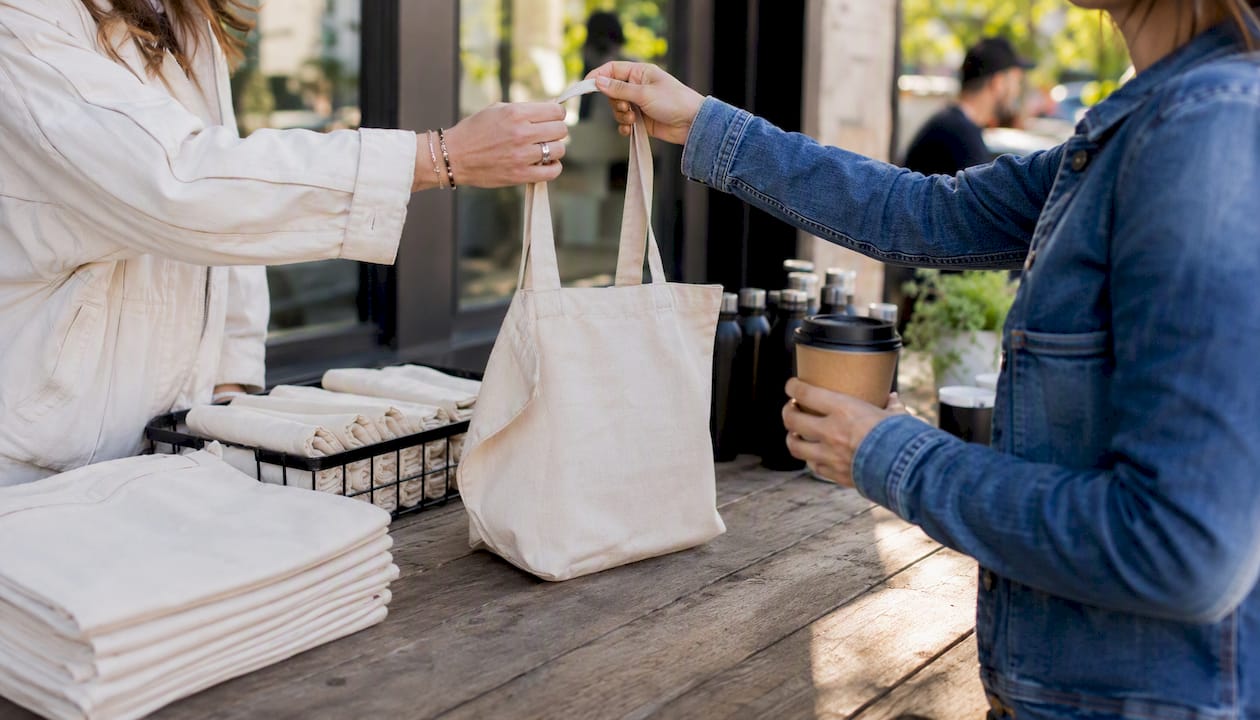 Hands exchanging gift at a pop-up event