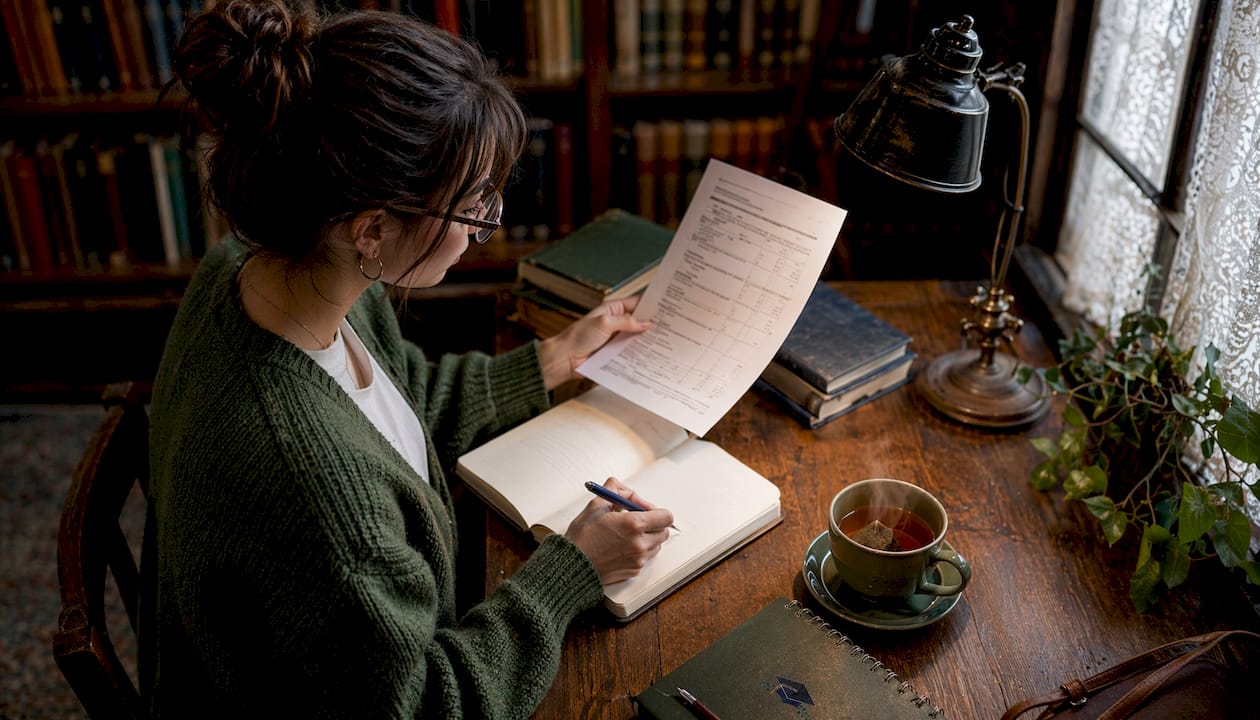 Student preparing for admissions interview at desk