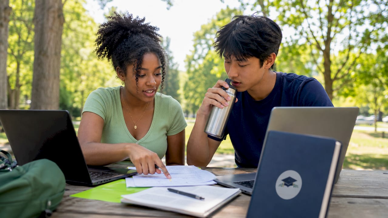 Two students collaborating on admissions essay
